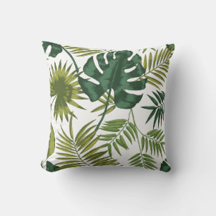 Square pillows with a tropical leaf pattern