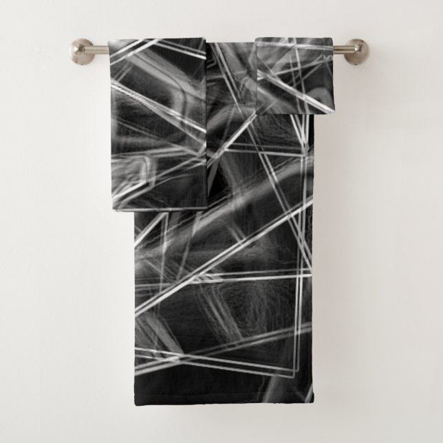 Squares corners in thick grey lines upon black bath towel set (Insitu)