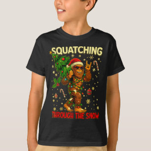Squatching Through The Snow Funny Bigfoot Xmas Lig T-Shirt