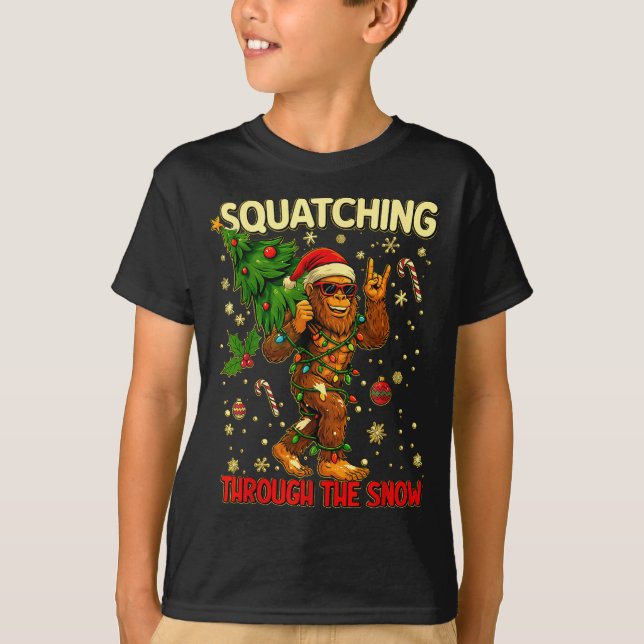 Squatching Through The Snow Funny Bigfoot Xmas Lig T-Shirt (Front)