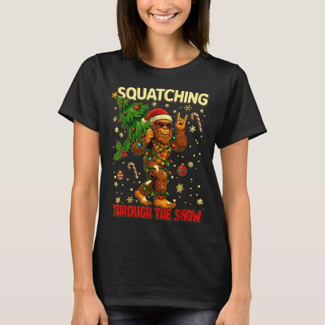 Squatching Through The Snow Funny Bigfoot Xmas Lig T-Shirt (Front)