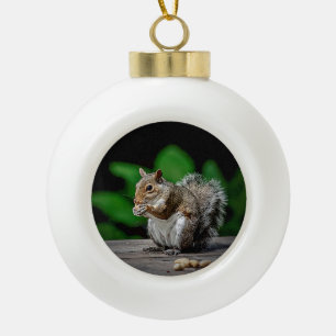 Squirrel with peanuts ceramic ball christmas ornament