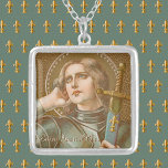 St. Joan of Arc (JM 28) Silver Plated Necklace<br><div class="desc">St. Joan of Arc, the “Maid of Orleans”, is patron saint of women who serve in the military. In this depiction, her military career is emphasized. St. Joan is clad in contemporary 15th-century plate armour and shoulders a sword in a scabbard ornamented with fleur di lis. The fleur di lis,...</div>