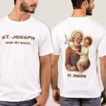 St. Joseph has my back T-Shirt<br><div class="desc">A beautiful traditional image of St. Joseph holding the Child Jesus with lilies on the back. Humourous text on the front. 
The text and font below may be modified.</div>