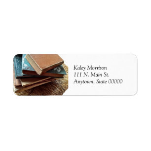 Stack of books on chair address label