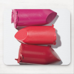 Stack of broken lipstick mouse pad