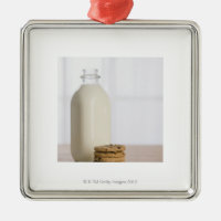 Stack of chocolate chip cookies milk in a glass