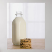 Stack of chocolate chip cookies milk in a glass