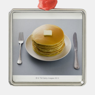 Stack of pancakes with butter on a plate metal ornament