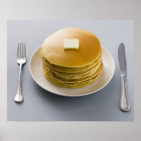 Stack of pancakes with butter on a plate