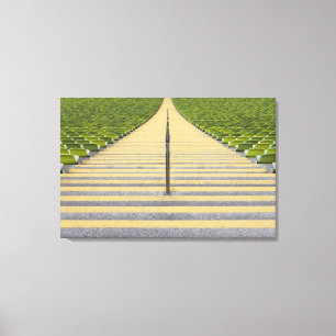 Stadium stairway between rows of green seats canvas print