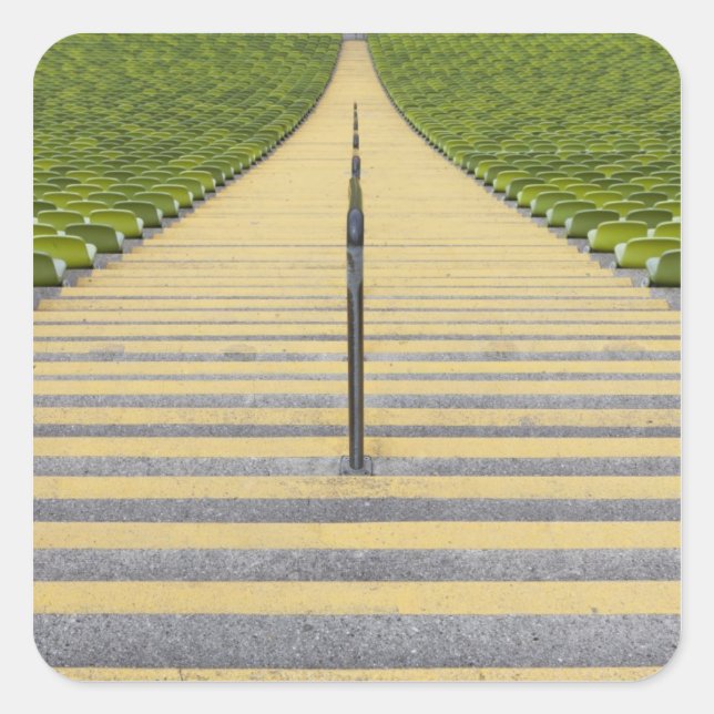 Stadium stairway between rows of green seats square sticker (Front)