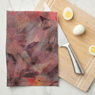 Stains in red hues on black grey grainy background kitchen towel