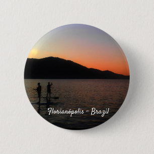 Stand up paddling in the sunset 2 inch round button