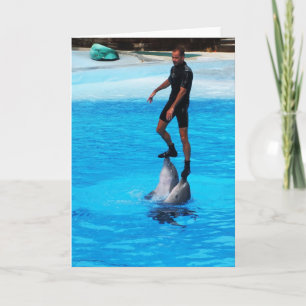 Standing on dolphins holiday card