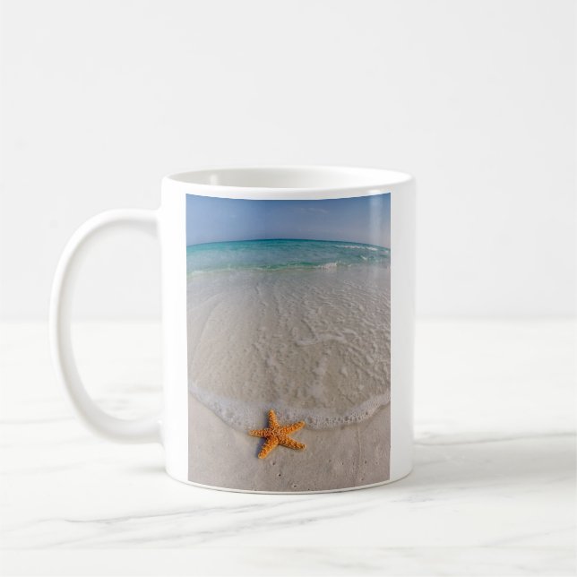 Starfish on beach coffee mug (Left)