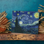 Starry Night Vincent van Gogh Fine Art Painting Plaque<br><div class="desc">Vincent van Gogh (Dutch, 1853 - 1890) Starry Night, 1889, Oil on canvas Unframed: 73 × 92 cm (28.7 × 36.2 in) This painting depicts the view from the east facing window of Van Gogh's asylum room at Saint-Rémy-de-Provence, he added an idealized village. It has been in the permanent collection...</div>