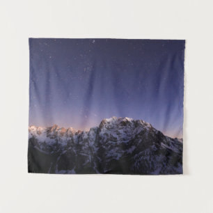 Starry sky above mountains tapestry