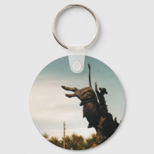 statue of a bullrider keychain