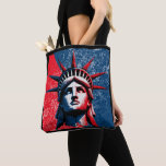 Statue of Liberty Tote Bag<br><div class="desc">Celebrate the timeless beauty of the Statue of Liberty with a fresh, modern twist. This exclusive design features the iconic face of Lady Liberty re-imagined in vibrant, contemporary colors, blending urban energy with historical elegance. Ideal for casual outings, city adventures, or as a unique gift for art enthusiasts and travelers....</div>