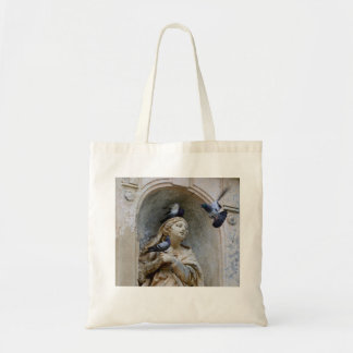 Statue with pigeons tote bag