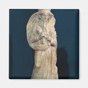Statuette of a woman playing a double flute magnet