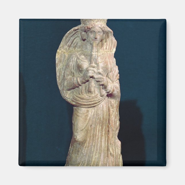 Statuette of a woman playing a double flute magnet (Front)