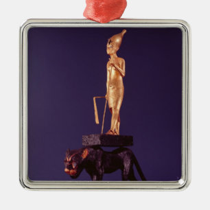 Statuette of the king upon a leopard metal ornament