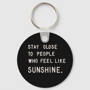 Stay close to people who feel like sunshine keychain