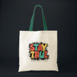 Stay True Tote Bag - Authenticity and Individualit<br><div class="desc">Make a statement with this unique tote bag featuring the empowering phrase 'STAY TRUE' in bold,  colourful letters. Perfect for daily use,  shopping,  or as a gift for friends and family who value authenticity and individuality. Made from high-quality materials,  this tote bag is both functional and fashionable."</div>
