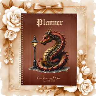 Steampunk Dragon next to a vintage street lamp.  Planner