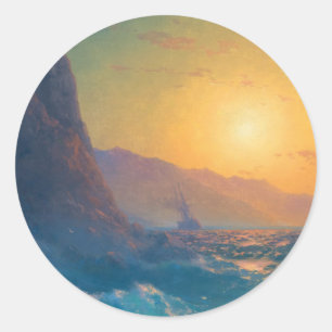 Steep rocky coast and a rough sea at sunset classic round sticker