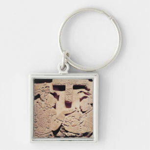 Stela depicting a woman presenting a jaguar mask keychain