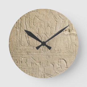 Stela depicting Ramesses II offering incense to hi Round Clock