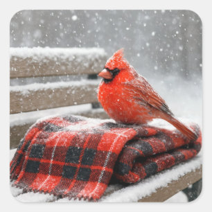 Sticker Carré Cardinal rouge de Noël sur une couverture à carrea