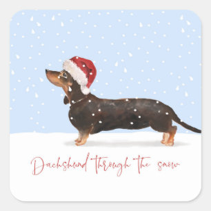 STICKER CARRÉ DACHSHUND À TRAVERS LA NEIGE JOLIMENT VACANCES