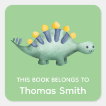 Garçon dinosaure vert et livres scolaires nominati