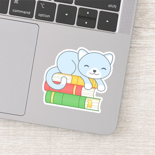 Sticker Chat mignon au-dessus de la pile de livres (Détail)