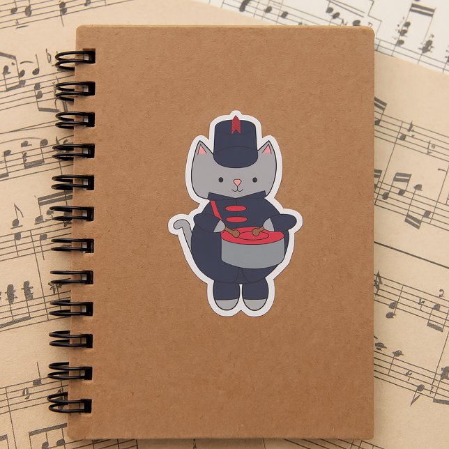 Sticker Drummer Marching Band Cat Navy Blue and Red (A sticker of a gray cat playing the snare drum in a red & navy blue marching band uniform.)