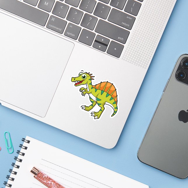 Sticker Illustration Mignonne D'Un Spinosaure Souriant. (Ordinateur portable avec iPhone)