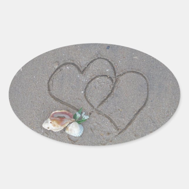 Sticker Ovale 2 Coeurs dans le sable avec des coquillages (Devant)