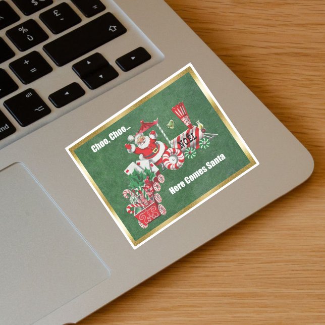 Sticker Père Noël sur le train de Noël Sucres de canne Gol (Santa Riding Christmas Train Candy canes, letters on green with gold border vinyl sticker.)