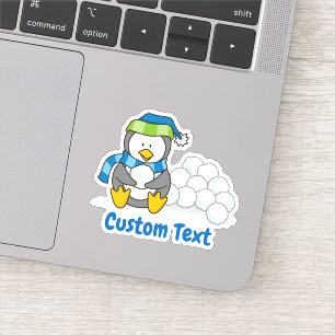 Sticker Petit pingouin assis avec des boules de neige