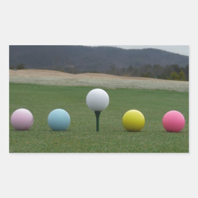 Sticker Rectangulaire Ballons de golf aux couleurs vives sur une montagn (Devant)