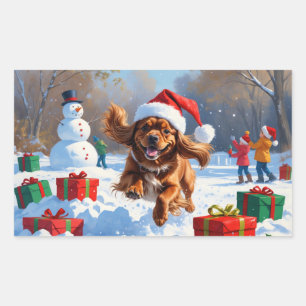 Sticker Rectangulaire Tibétain Spaniel courant dans la neige avec un cha