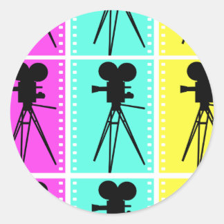 Sticker Rond Bande de film en couleur et silhouette de caméra