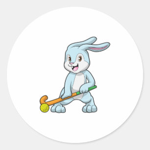Sticker Rond Bunny au hockey sur gazon avec bâton de hockey