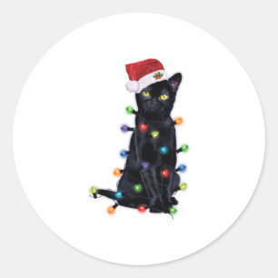 Sticker Rond Chat de Père Noël noir avec guirlandes de Noël