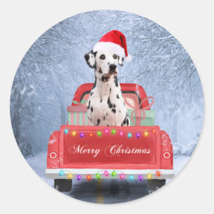 Sticker Rond Chien dalmate en neige assis dans un camion de Noë