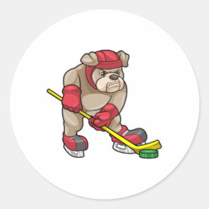 Sticker Rond Chien de taureau au hockey sur glace avec bâton de
